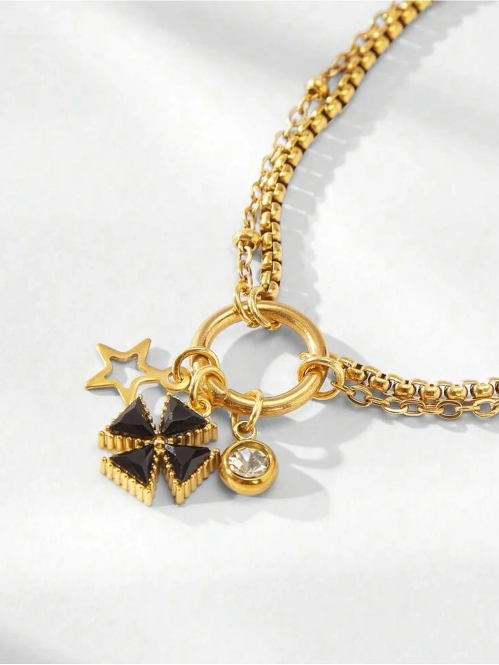 Gold Multi chain Bracelet with Black  Clover Charm